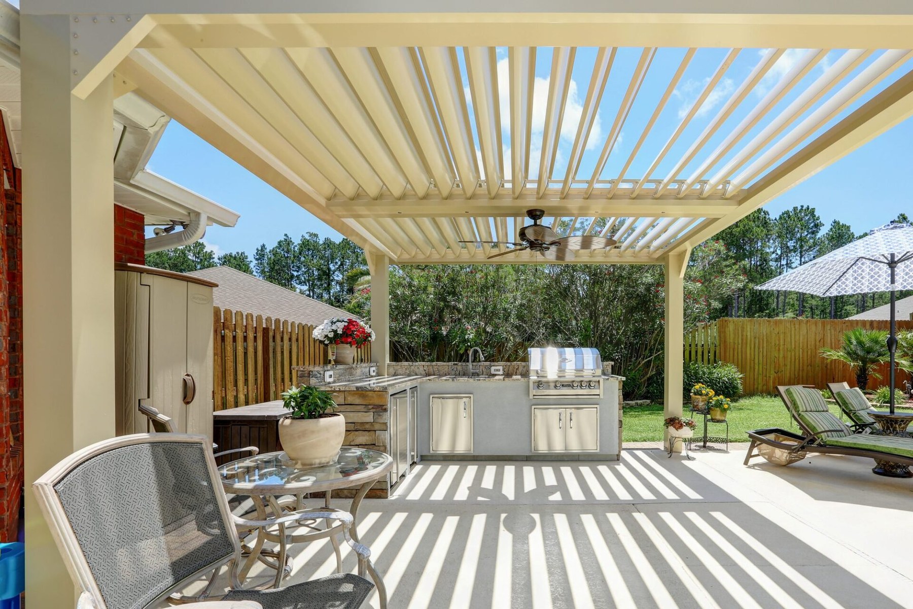 Equinox louvered roof over an outdoor dining space
